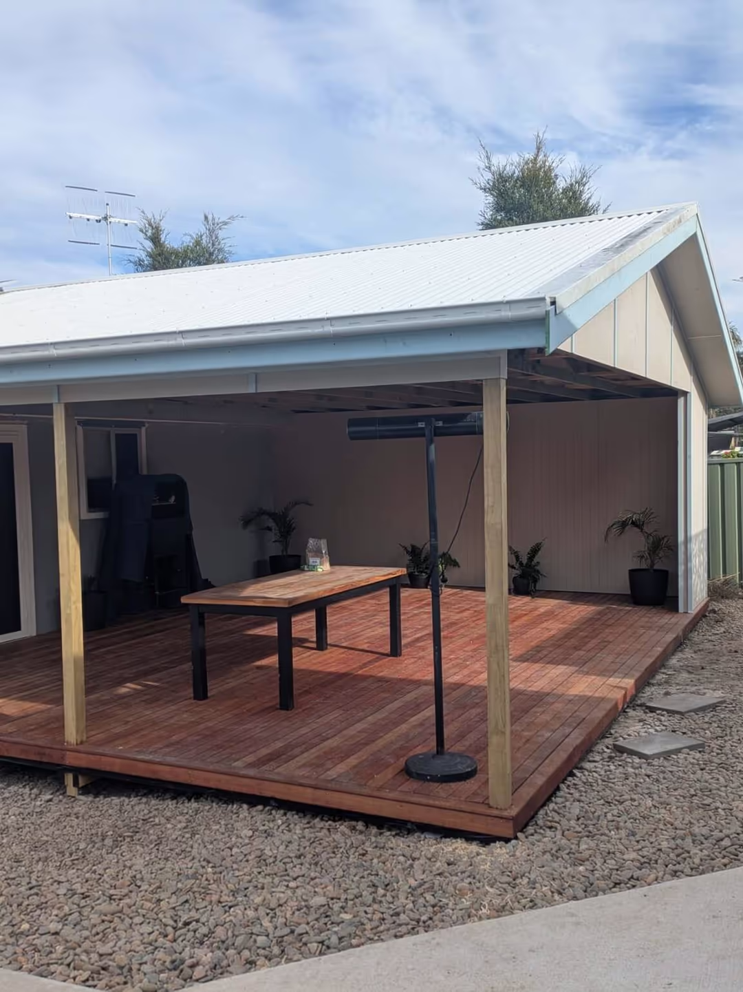 Finished undercover entertaining area with gabled roof and Merbau decking