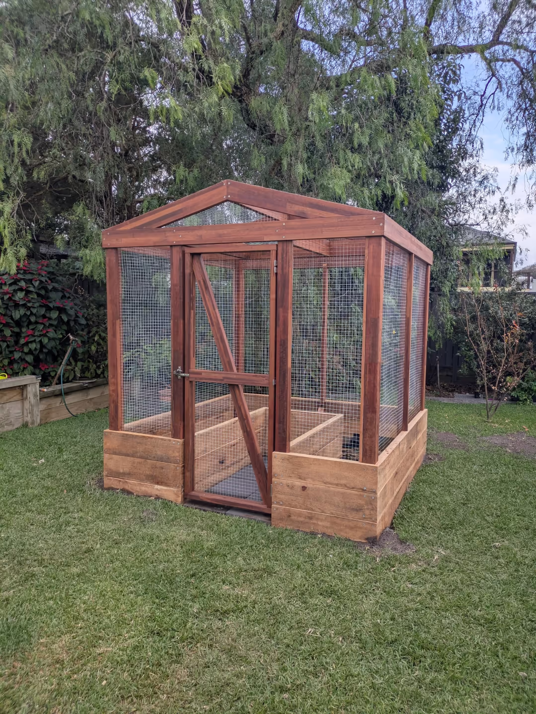 Finished garden bed fully enclosed in mesh