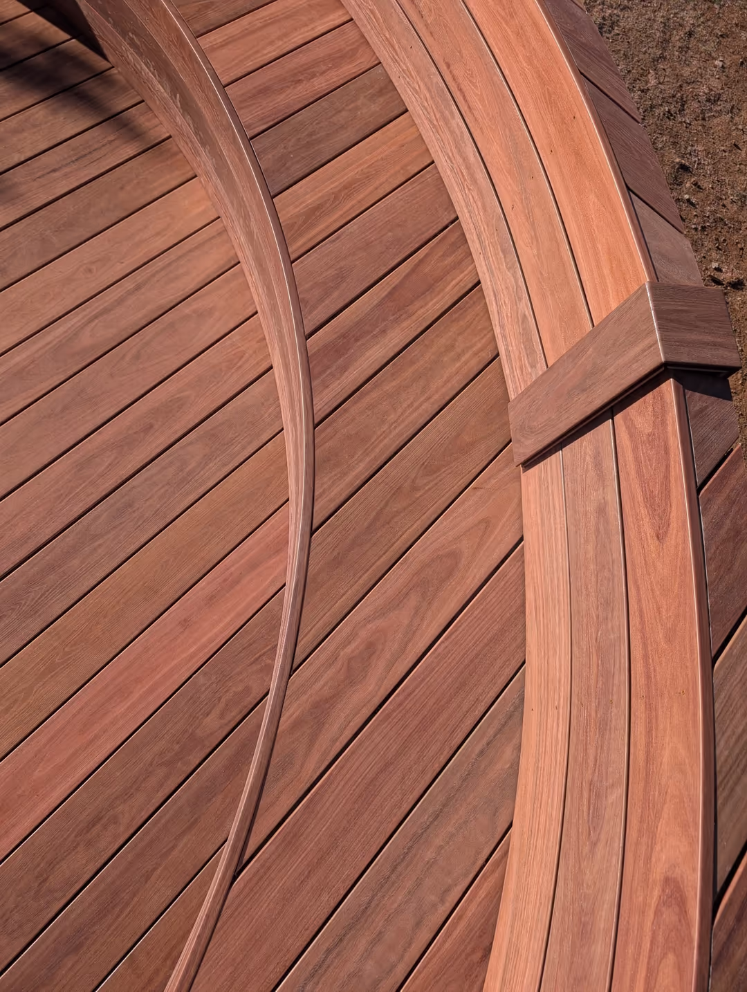 Close-up of the curved decking and bench detail
