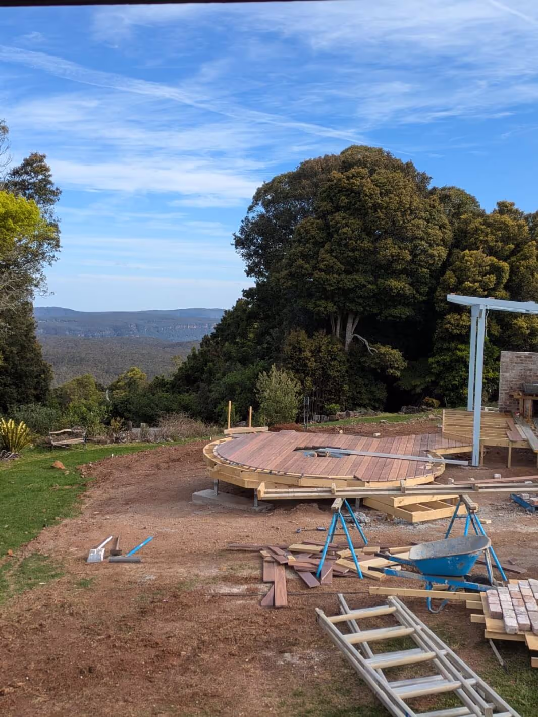 Hilltop site with the curved deck taking shape and valley views